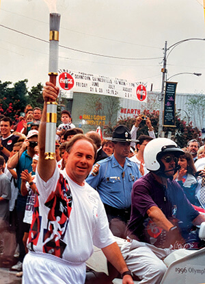 Jim Mathis Jr. carries Olympic Torch in downtown Gainesville - 1996