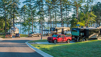 Margaritaville RV Resort - RV in space with trees and lakeview