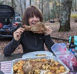 Camper eating turkey leg