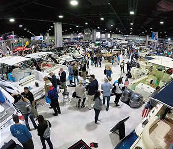 Boats and people in showroom of past Atlanta Boat Show