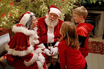 Santa and Mrs. Claus with two children