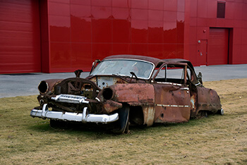 Rusted out 1954 Plymouth Savoy car