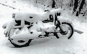 a BMW motorcycle covered in snow.