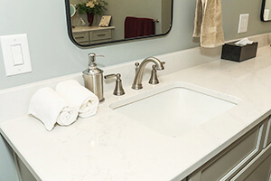 Remodeled bathroom - sink, mirror, light gray and white colors