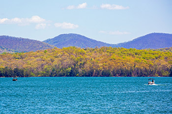 Bluegreen waters of Lake Blue Ridge with mountains and trees in background