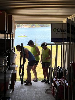 Three members of LLRC move boathouse contents to storage units