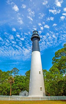 The old Hunting Island Lighthouse against blue sky