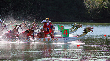 Dragon boat crossing finish line on Lake Lanier.