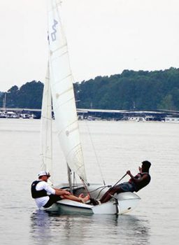 Student on sailboat learning to distribute his wait to make the boat go.