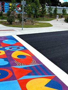 Colorful mural painted on a crosswalk.