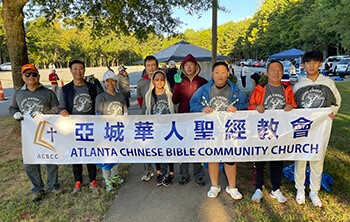 Shore Sweep Participants from Atlanta Chinese Bible Community Church line up behind banner