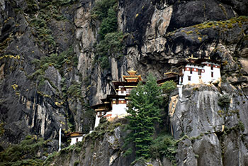 View of Tiger's Nest Monastery tucked into the rocky hillside.
