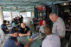 View of first responders seated for lunch at various tables.