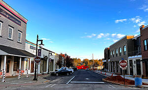 Historic Flowery Branch businesses line both sides of a newly paved street. 