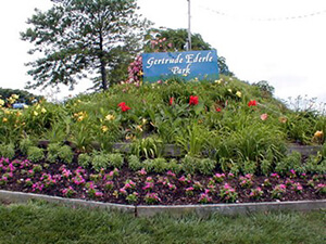 The main sign and garden at Gertrude Ederle Park in New Jersey