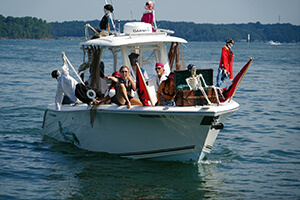 Large boat on Lake Lanier with people dressed up in Pirate-related outfits. 