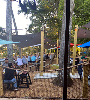Outside seating under shade sails at Skogies Restaurant, Gainesville Marina.