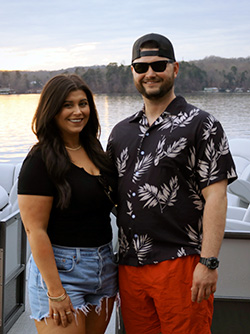 Katie Copeland, standing with her brother Lance with the lake in the background.