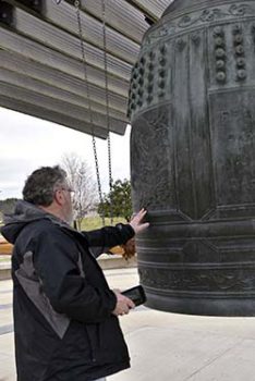 Ray Smith with the International Friendship Bell. 