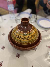 A traditional tajine sitting on top of a table. 